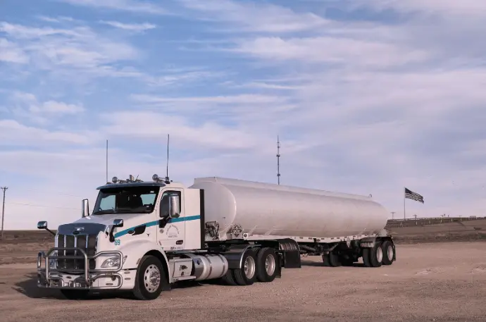Mobile fuel delivery truck transporting fuel to commercial fleet