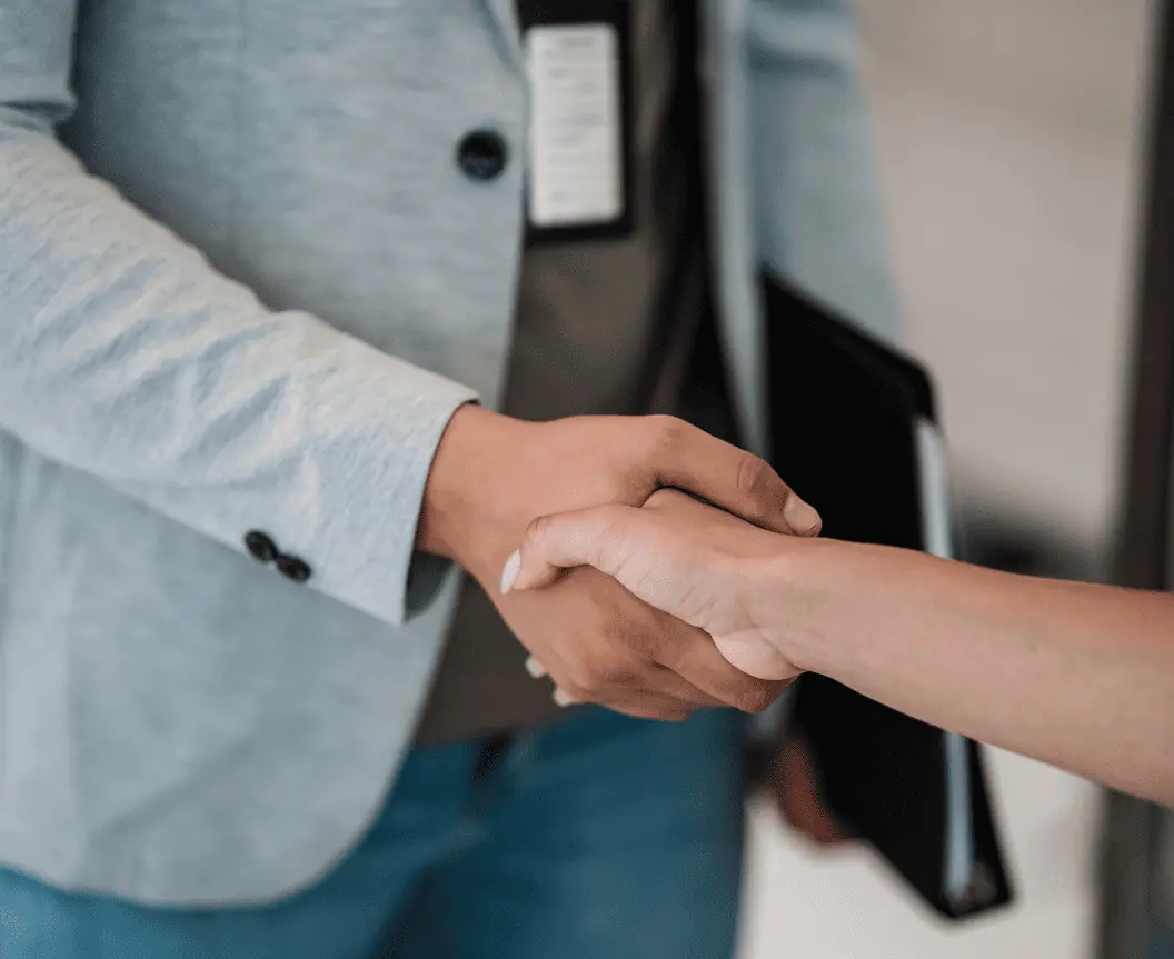 Business professionals handshaking for fuel infrastructure partnership